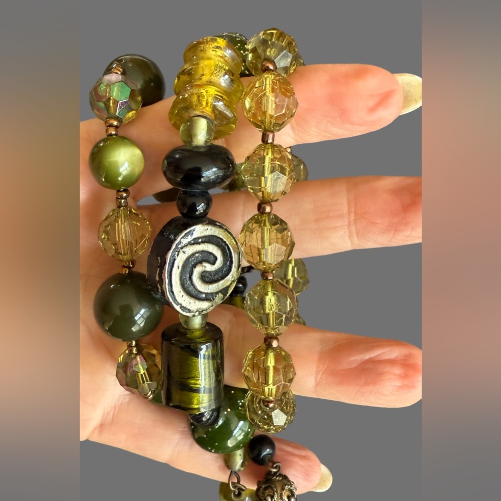 Set of three green themed artisan bracelets